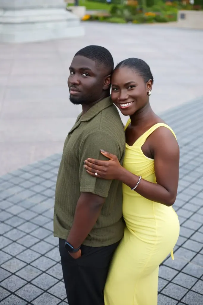 Couple in olive and yellow, cheek to cheek
