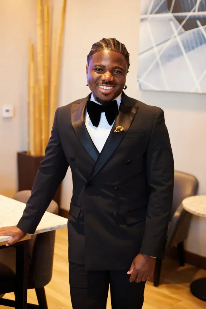 Groom in a double-breasted tuxedo and velvet bow tie